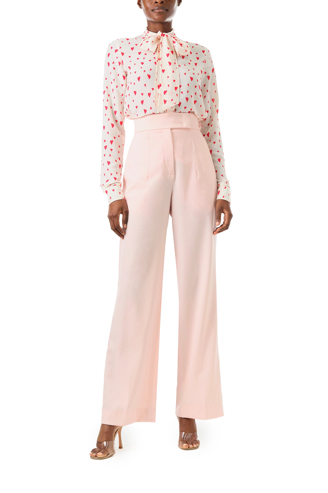 Monique Lhuillier Fall 2024 pale blush wool, straight leg trouser with pockets - front with heart print blouse.