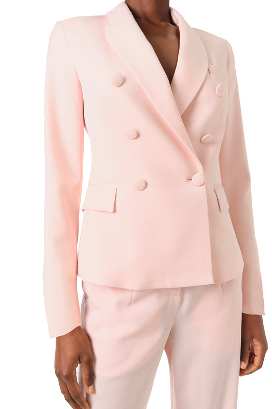 Monique Lhuillier Fall 2024 pale blush wool, double breasted wool blazer with full length sleeve - front crop.