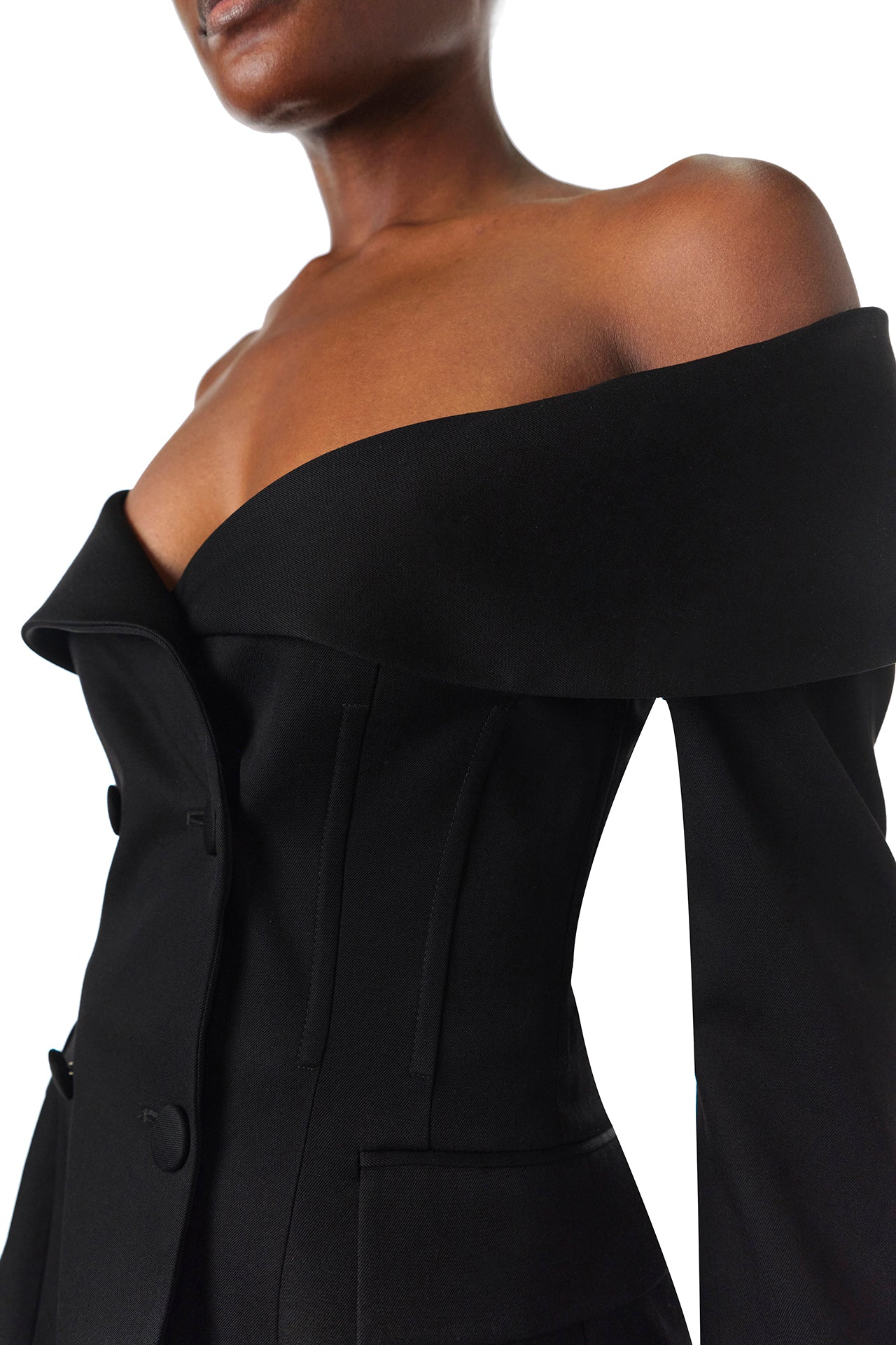 Monique Lhuillier Fall 2024 long sleeve corseted jacket with off-the-shoulder neckline in black wool - corseted details.