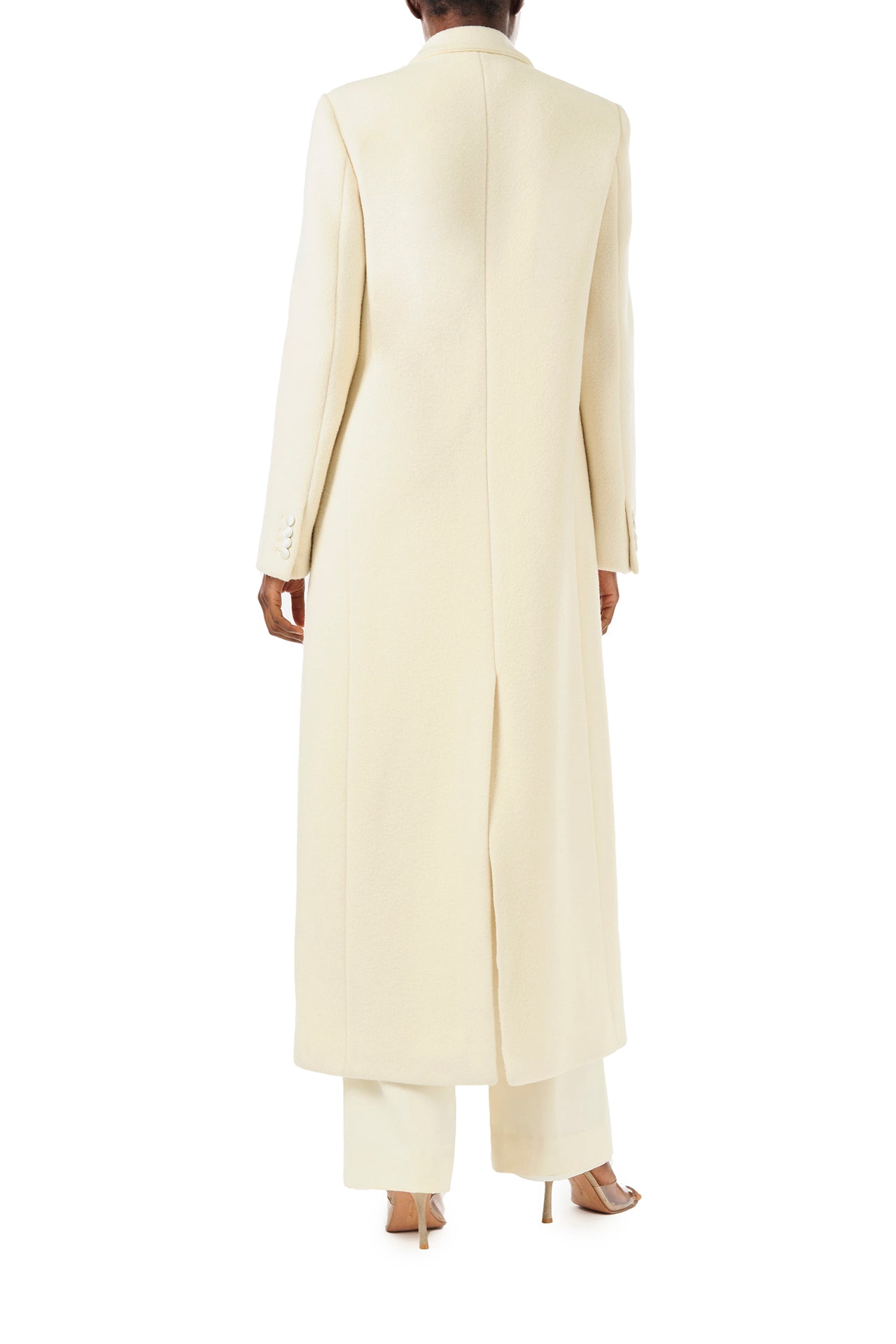 Monique Lhuillier Fall 2024 long sleeve coat in creme colored wool and single closure button - back.