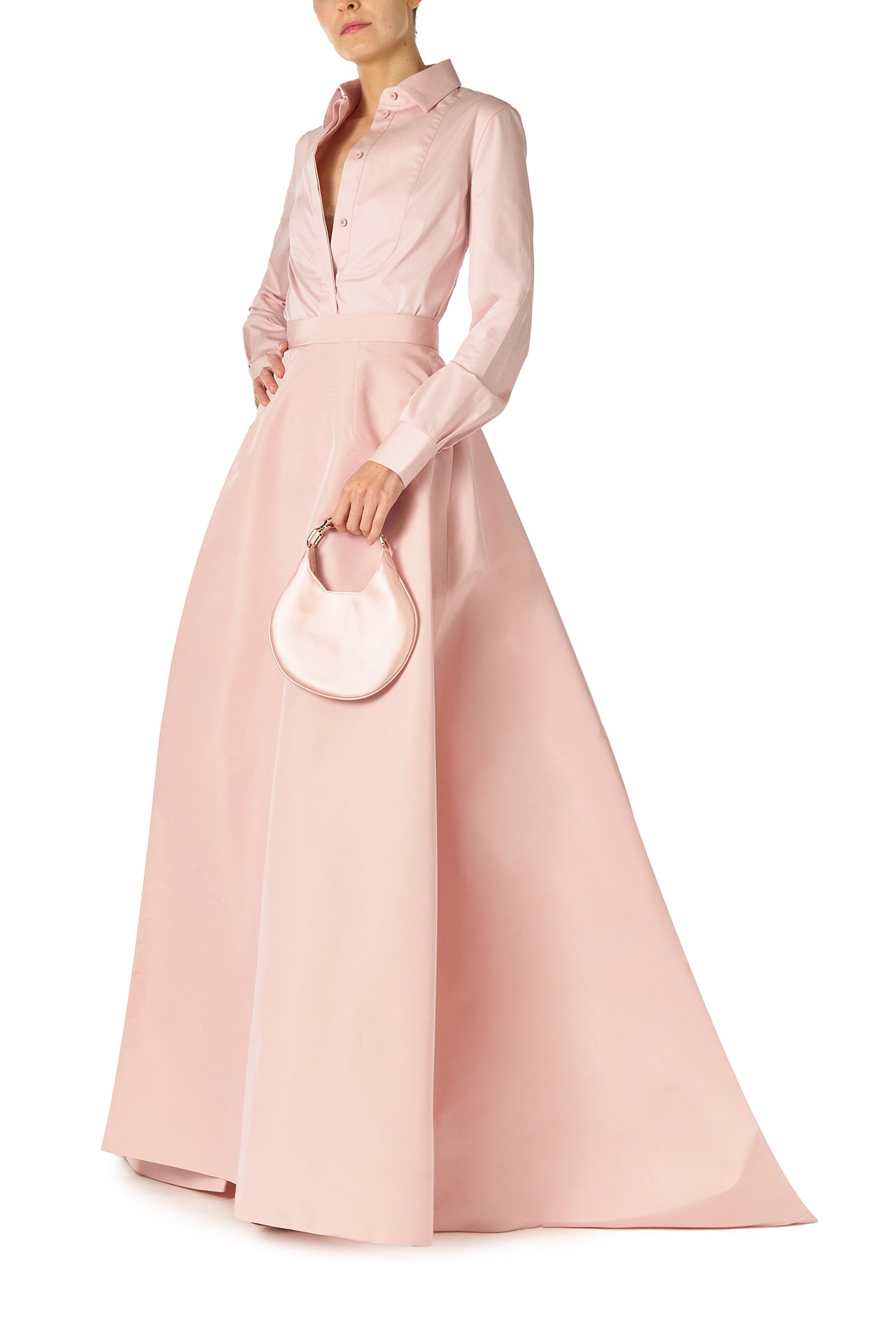 Monique Lhuillier Fall 2024 Full ball skirt with high leg slit and pockets in Pale Blush faille fabric - front with Demi bag.