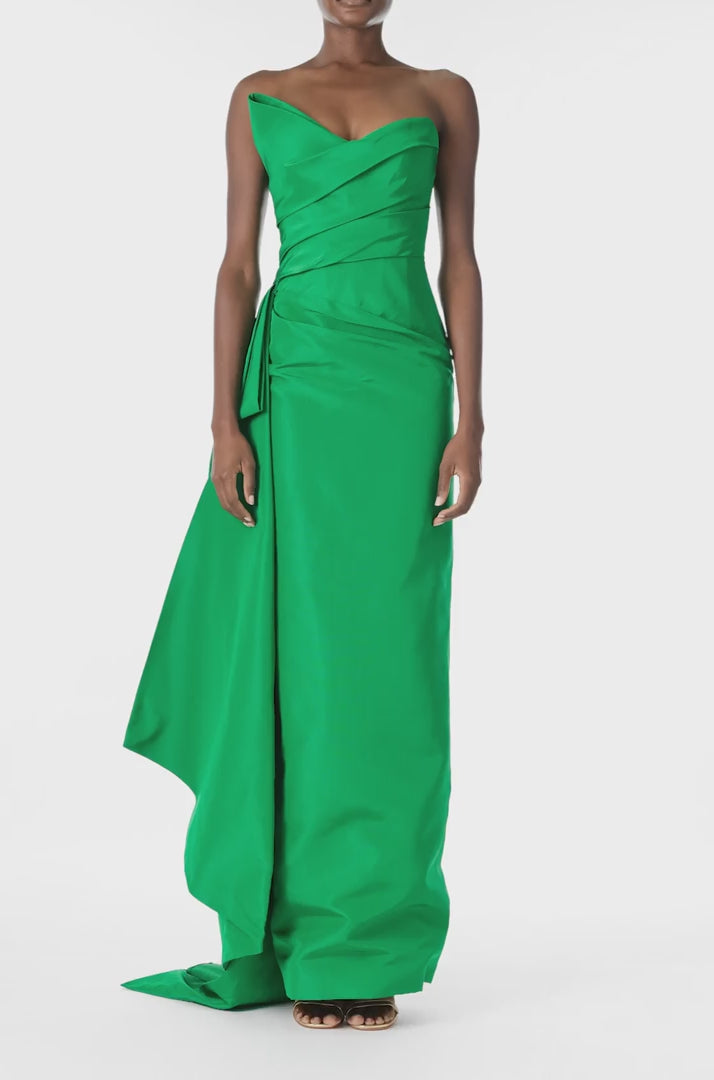 Monique Lhuillier Spring 2025 Strapless column gown with asymmetric draped neckline and sweeping side train in grass green faille fabric - video.