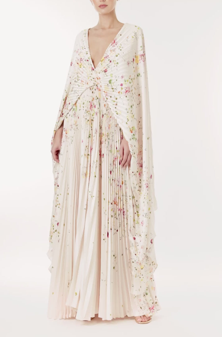 Monique Lhuillier floral printed plisse caftan with deep v neckline and cape sleeves.