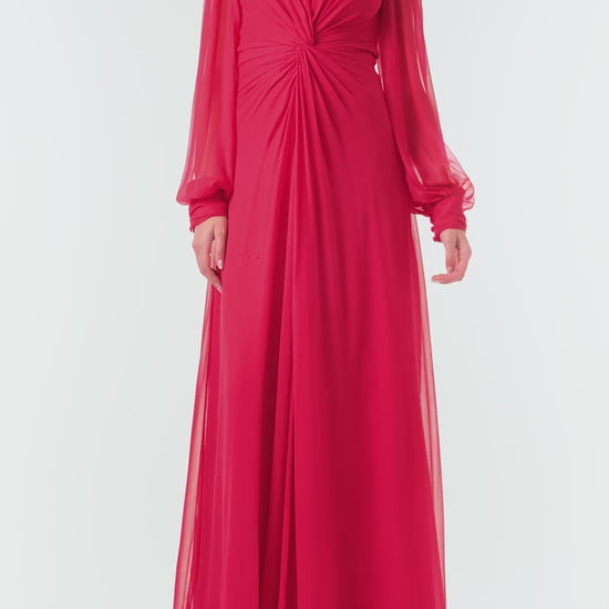 Monique Lhuillier Fall 2024 pomegranate chiffon, long sleeve gown with twist front detail, keyhole back and semi-sheer sleeves - video.