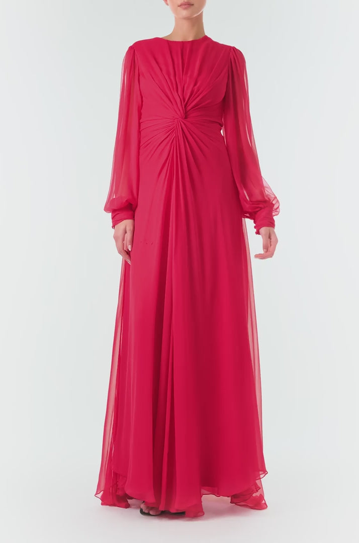 Monique Lhuillier Fall 2024 pomegranate chiffon, long sleeve gown with twist front detail, keyhole back and semi-sheer sleeves - video.