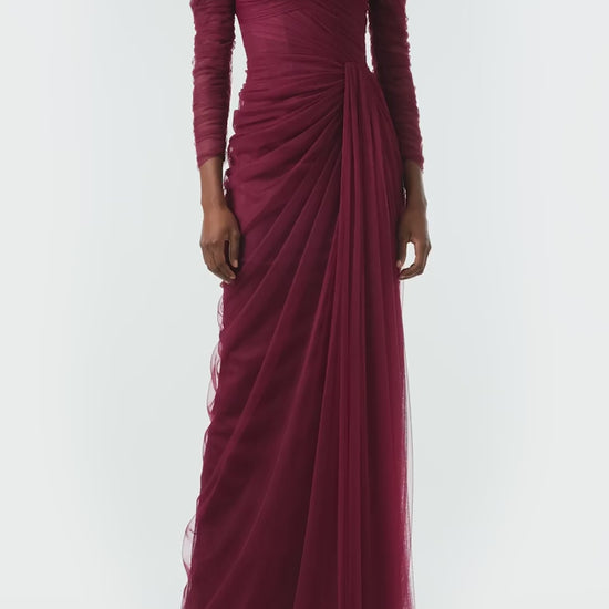 Monique Lhuillier Fall 2024 Off the shoulder draped tulle gown with low V-back, long sleeves and corseted bodice in Merlot - video.