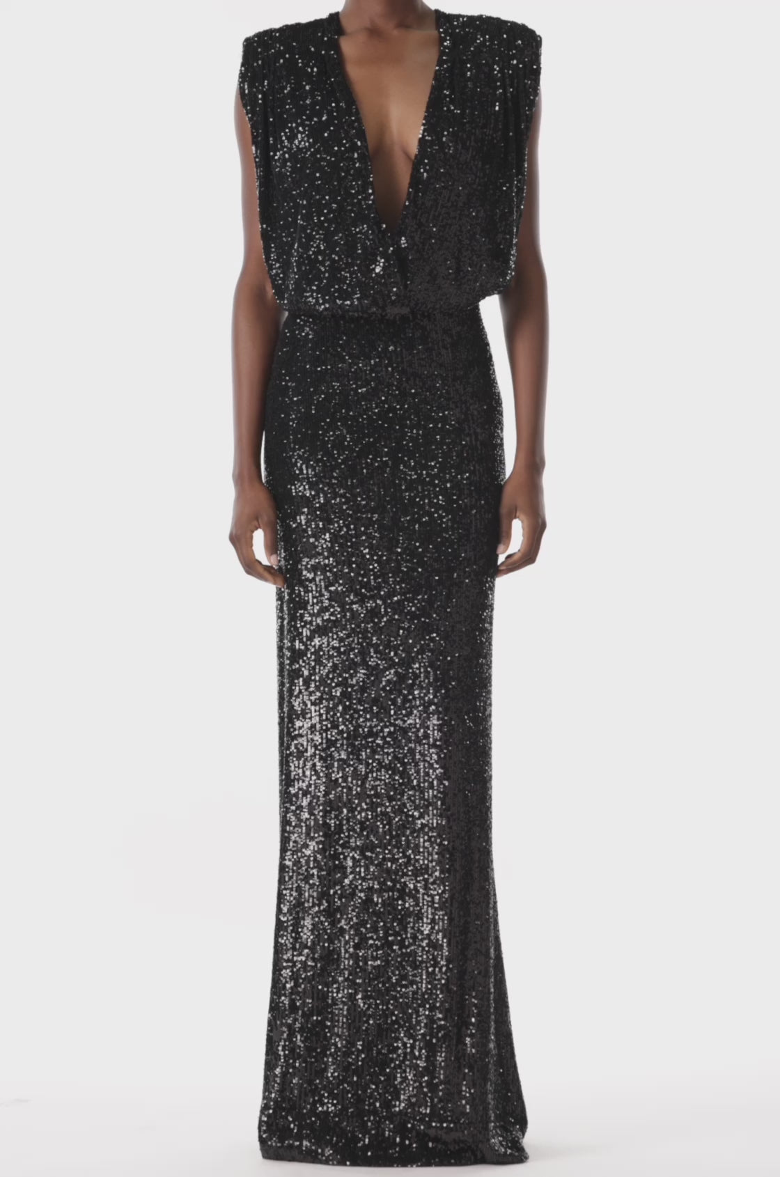 Monique Lhuillier black stretch sequin gown with deep v-neck front.