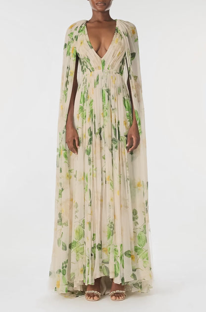 Monique Lhuillier Spring 2025 Draped, v-neck gown in Rose Printed Chiffon with low back and flowing, integral cape - video.