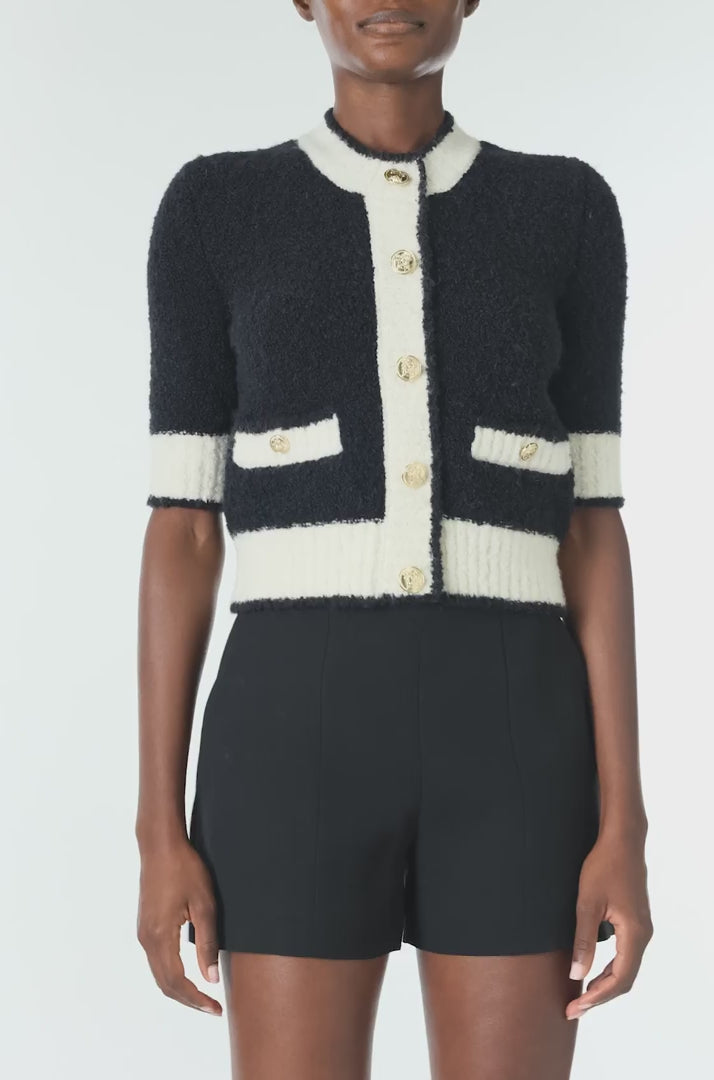 Monique Lhuillier Spring 2025 Short sleeve knit cardigan in Noir/Silk White Boucle - video.