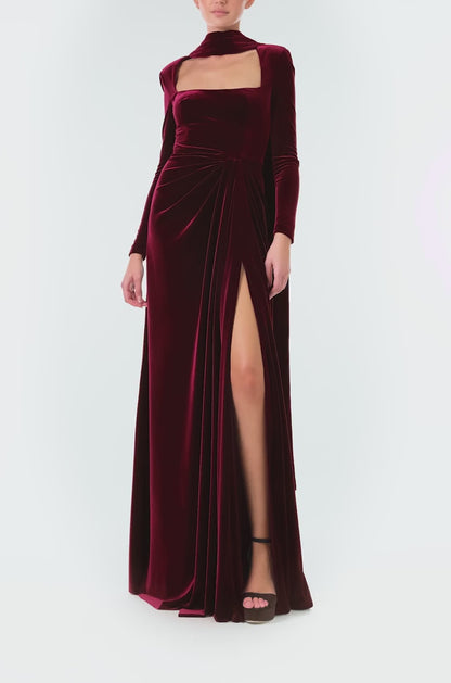 Monique Lhuillier Fall 2024 Long sleeve gown with square neckline, front skirt draping and detached neck scarf in Merlot colored stretch velour - video.