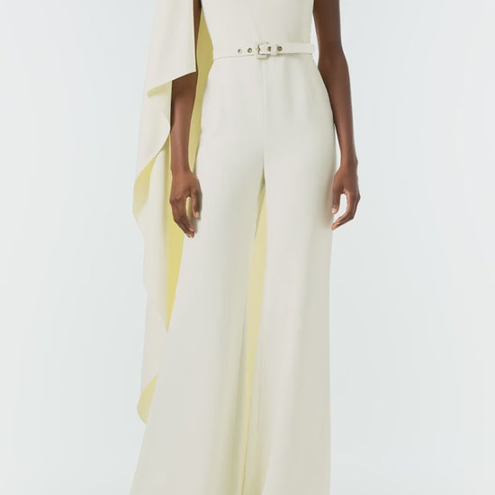 Monique Lhuillier Fall 2024 one shoulder draped jumpsuit with cascading sleeve and belt at waist - video.