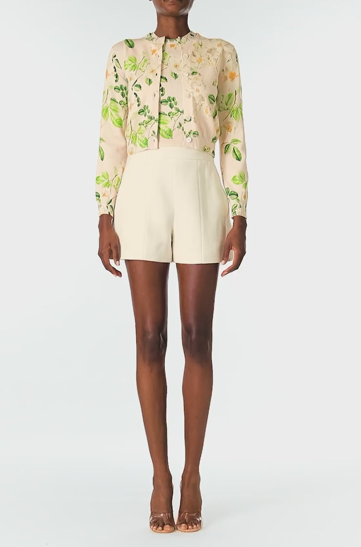 Monique Lhuillier Spring 2025 rose printed knit long sleeve cardigan with button center front closure in Bellini Multi - video.