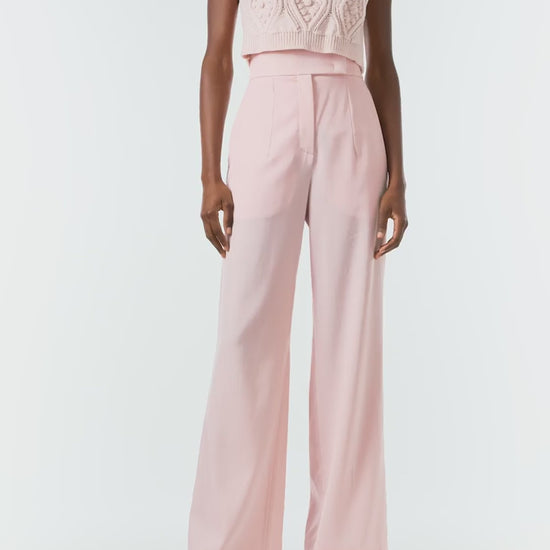 Monique Lhuillier Fall 2024 sleeveless, bobble crop tank in pale blush wool cable knit - video.