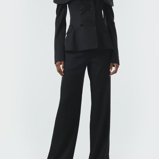 Monique Lhuillier Fall 2024 long sleeve corseted jacket with off-the-shoulder neckline in black wool - video.