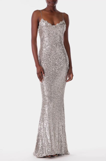 Monique Lhuillier silver sequin slip gown with spaghetti straps.