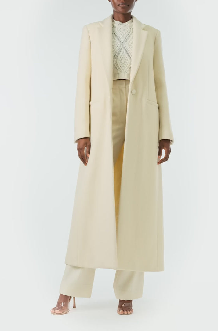 Monique Lhuillier Fall 2024 long sleeve coat in creme colored wool and single closure button - video.