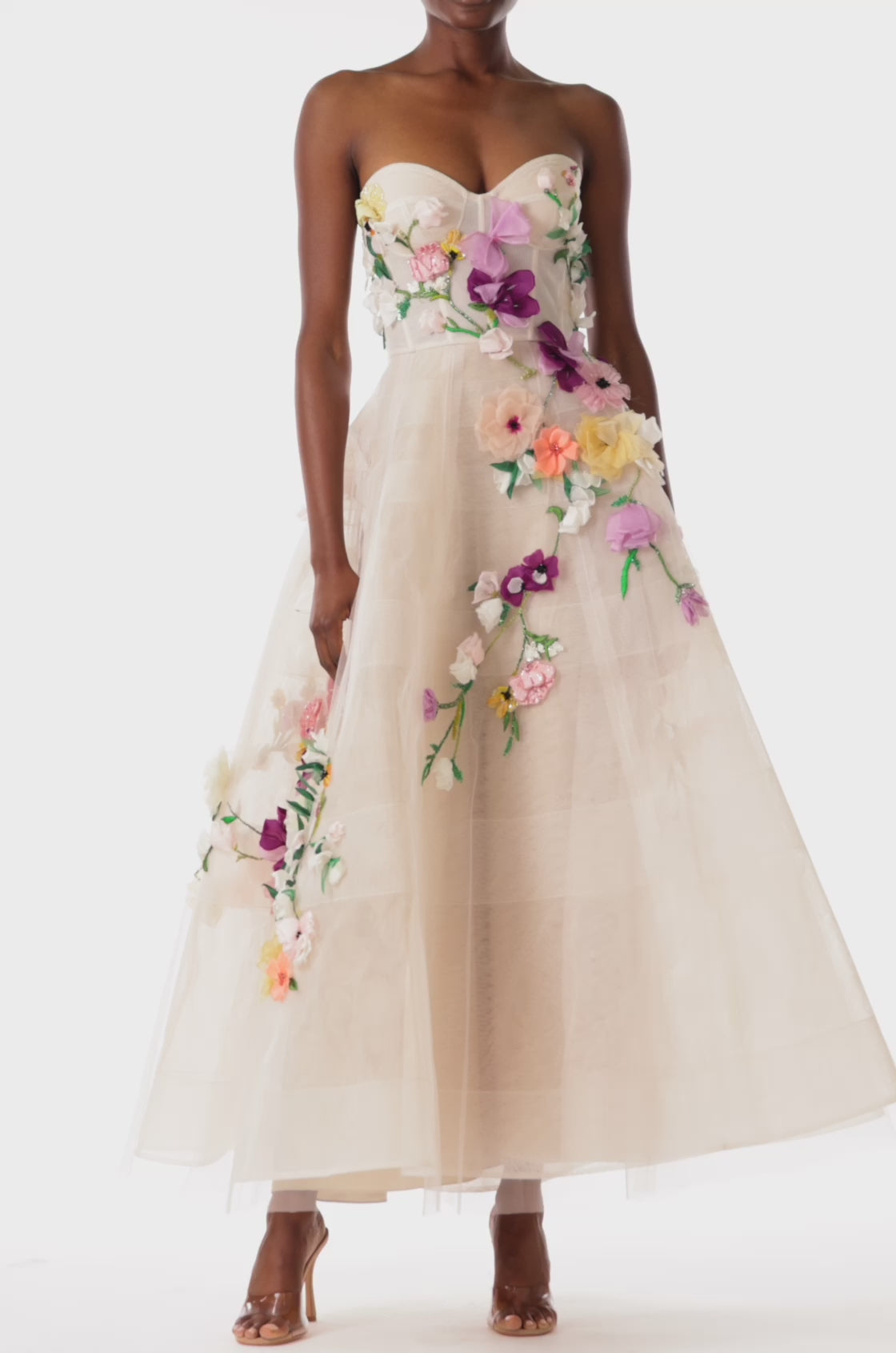 Monique Lhuillier pale blush colored strapless tulle cocktail dress with floral embroidery.