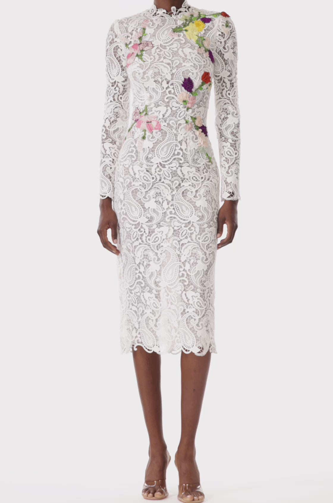 Monique Lhuillier midi length, long sleeve white lace dress with floral embroidery.