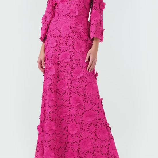 Monique Lhuillier Fall 2024 bell sleeve, floor length gown with deep v-neckline in Fuchsia 3D Guipure Lace - video.