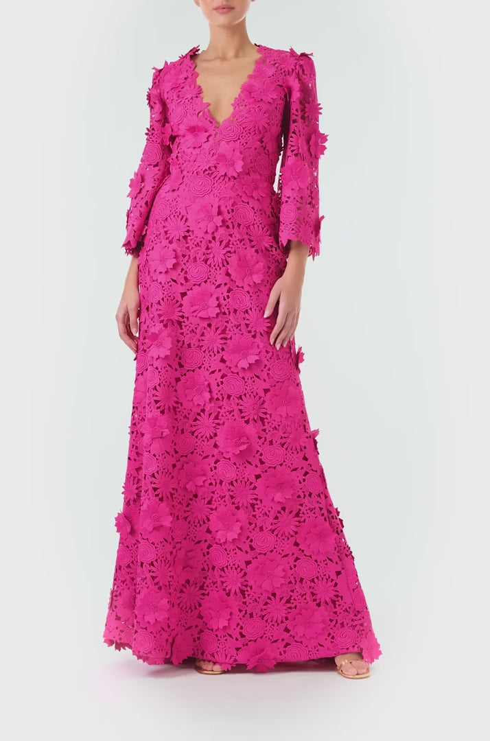 Monique Lhuillier Fall 2024 bell sleeve, floor length gown with deep v-neckline in Fuchsia 3D Guipure Lace - video.