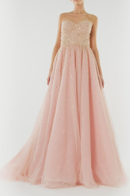 Monique Lhuillier strapless ballgown in rose colored tulle and gold embroidery.