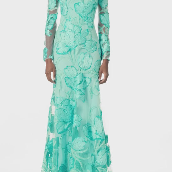 Monique Lhuillier Spring 2025 Embroidered, aqua floral tulle long sleeve trumpet gown with jewel neckline - video.