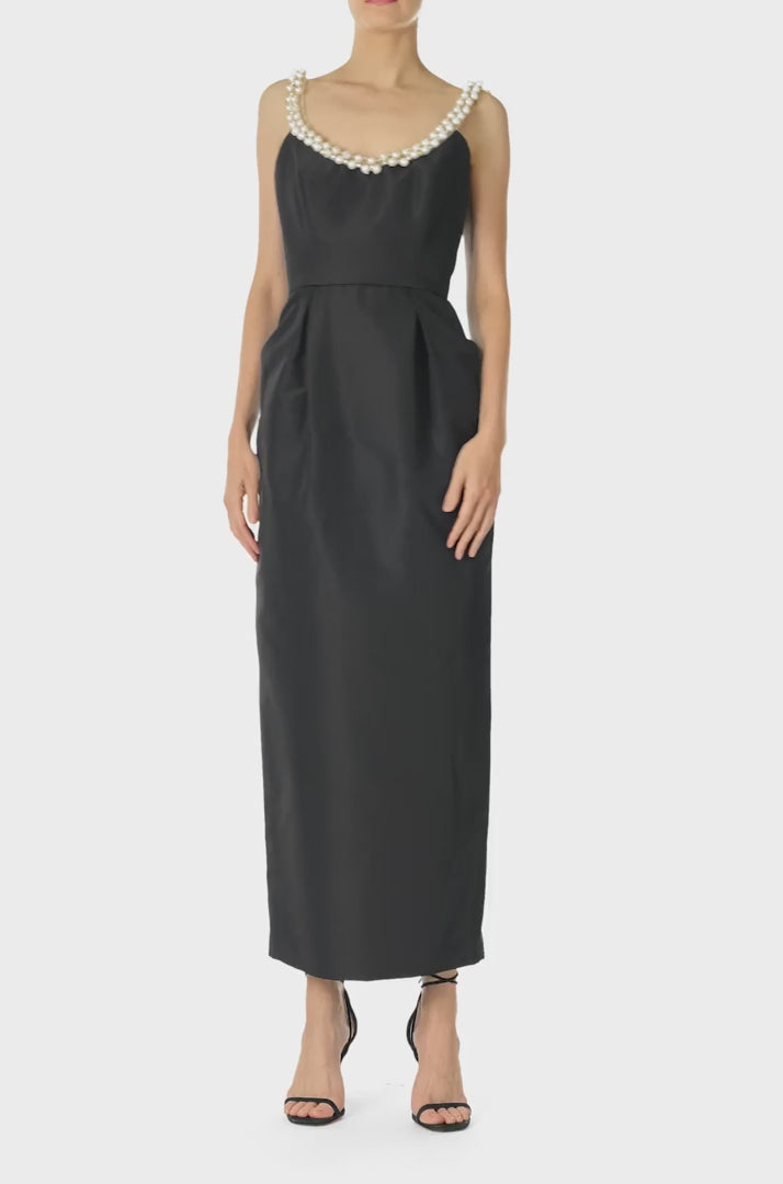 Monique Lhuillier Fall 2024 Sleeveless, scoop neck cocktail dress with pockets and pearl embroidered neckline in noir silk faille - video.