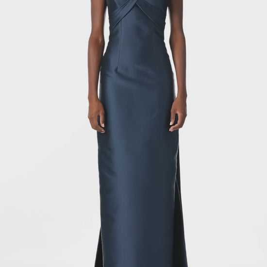 Monique Lhuillier Spring 2025 Off the shoulder gown with draped, low cut V-neckline and with integral draped ties down the back in Lapis Mikado - video.