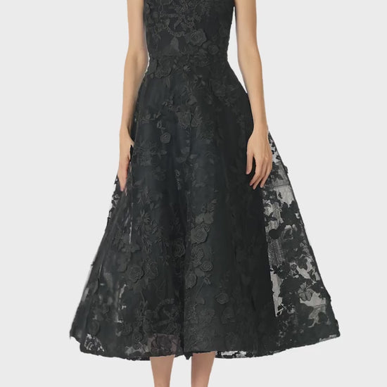 Monique Lhuillier Fall 2024 tea-length, strapless dress in noir 3D lace with full skirt and fitted sweetheart bodice - video.