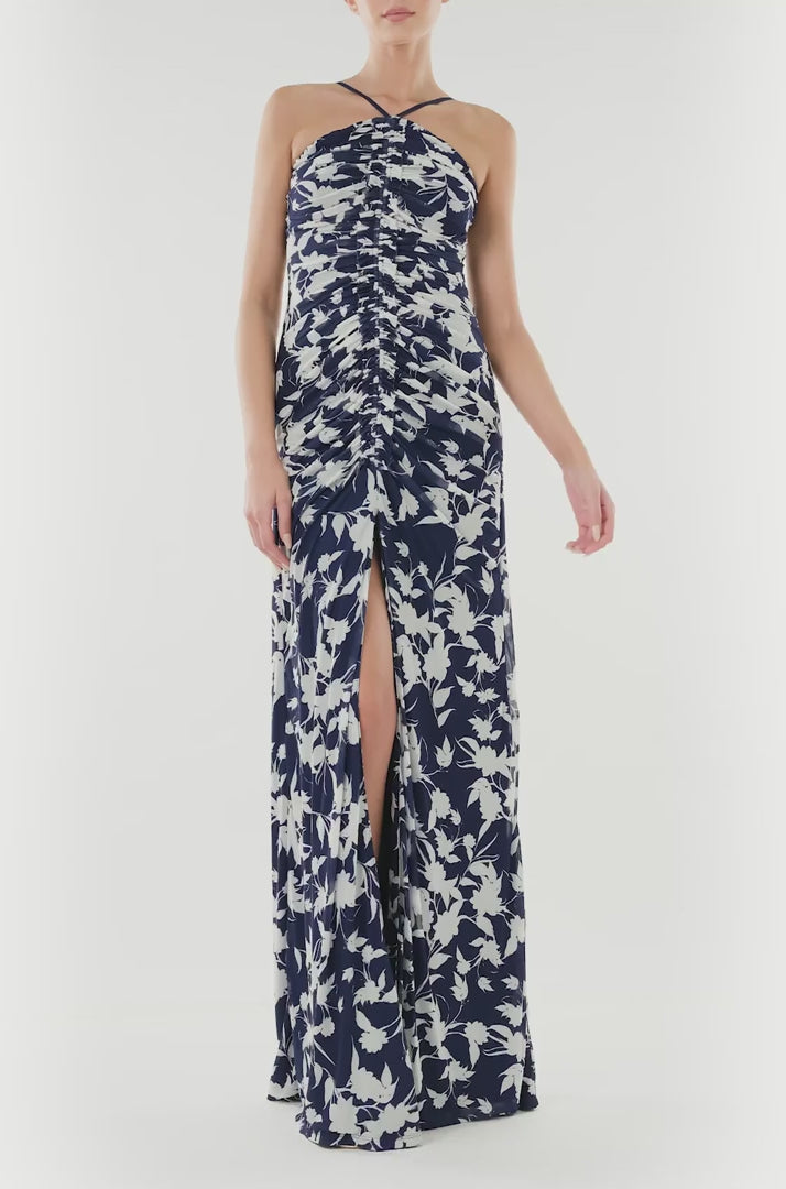 ML Monique Lhuillier floor length dress with halter neckline and ruching in indigo printed mesh.