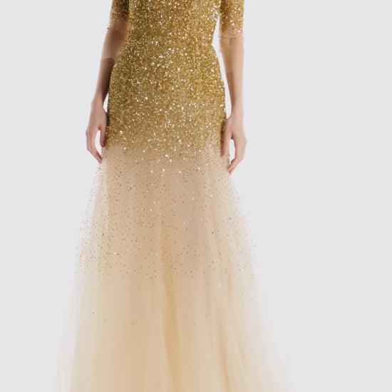 Monique Lhuillier illusion neckline and sheer 3/4 sleeve ballgown with cascading gold embroidery.