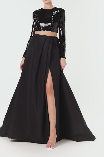 Monique Lhuillier black silk faille ball skirt with high leg slit.