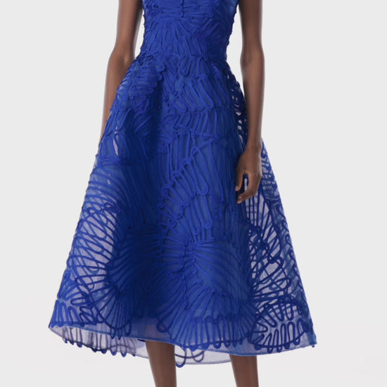 Monique Lhuillier embroidered royal blue strapless cocktail dress with tea-length full skirt.