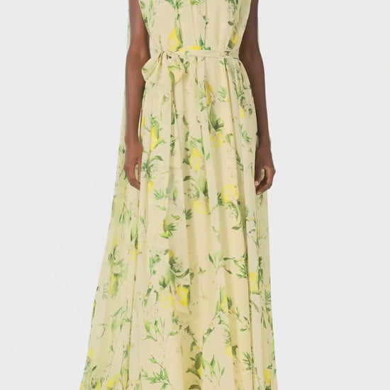 Monique Lhuillier Spring 2025 Lemon printed georgette sleeveless draped gown with integral cape - video.