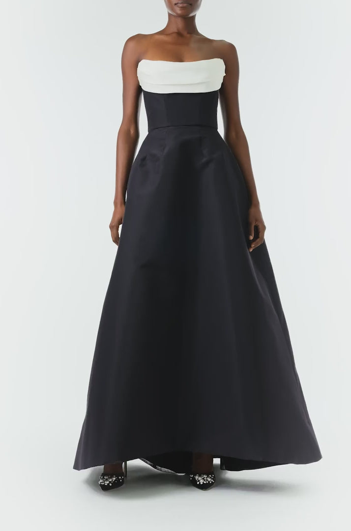 Monique Lhuillier Fall 2024 strapless ball gown with front-draped, contrasting neckline in noir/silk white faille fabric - video.