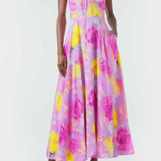 ML Monique Lhuillier 2024 Sleeveless midi dress with floral appliqued spaghetti straps and corset bodice in pink, purple and yellow floral printed linen - video.