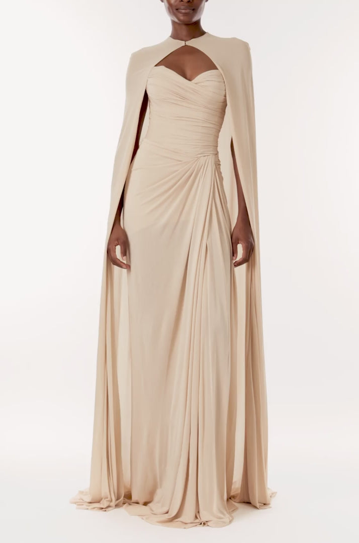 Monique Lhuillier floor length cape in sand colored matte jersey fabric.