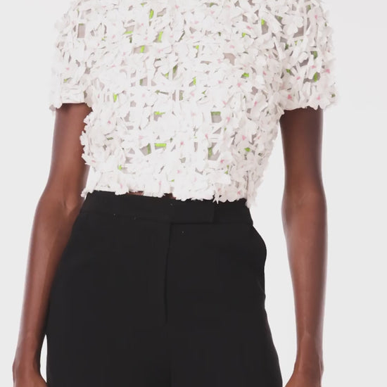 Monique Lhuillier crop top with short sleeves in silk white floral embroidery.