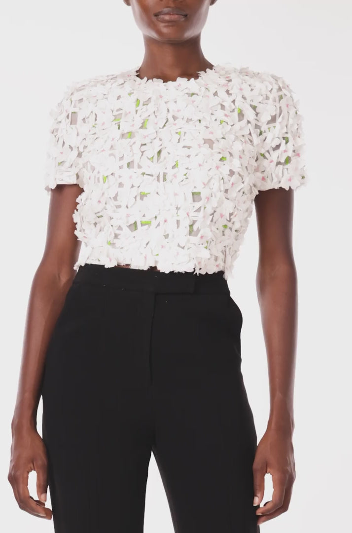 Monique Lhuillier crop top with short sleeves in silk white floral embroidery.