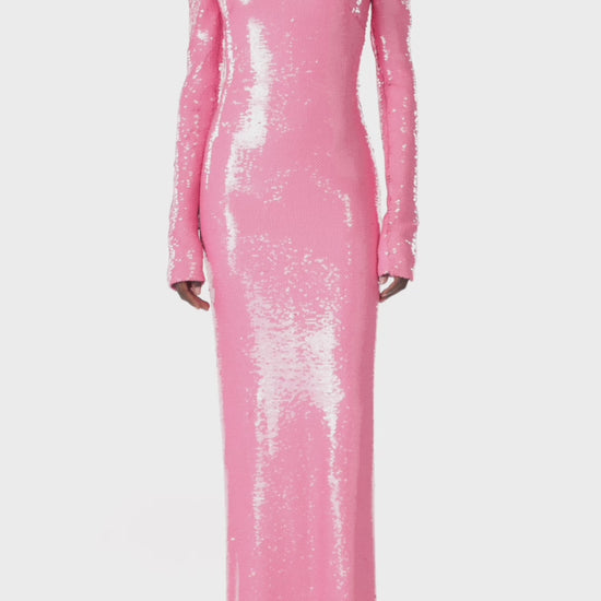 Monique Lhuillier pink sequin column gown with long sleeves and a scoop neckline.