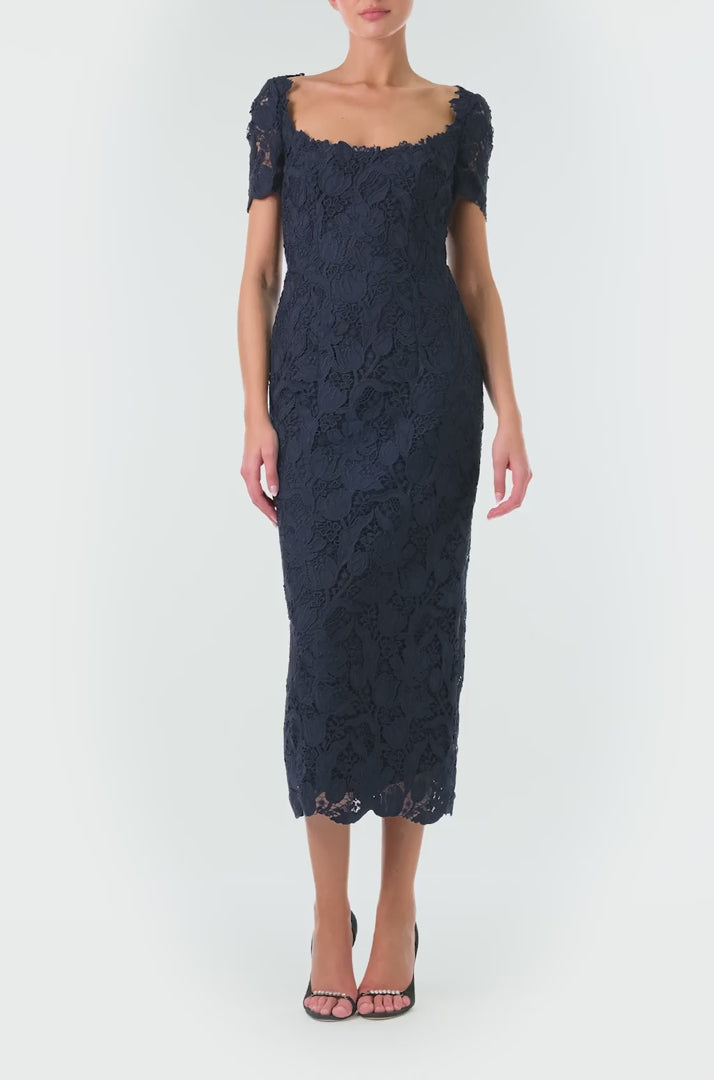 Monique Lhuillier Fall 2024 night sky colored lace sheath dress with short sleeves, scoop neckline and lace scalloped detailing - video.