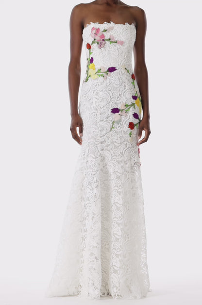 Monique Lhuillier white lace strapless gown with floral embroidery.