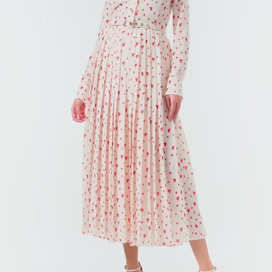 Monique Lhuillier Fall 2024 long sleeve, shirt dress with pleated skirt and belted waist in Heart Print Georgette.&nbsp; Collared neckline and button closure - video.