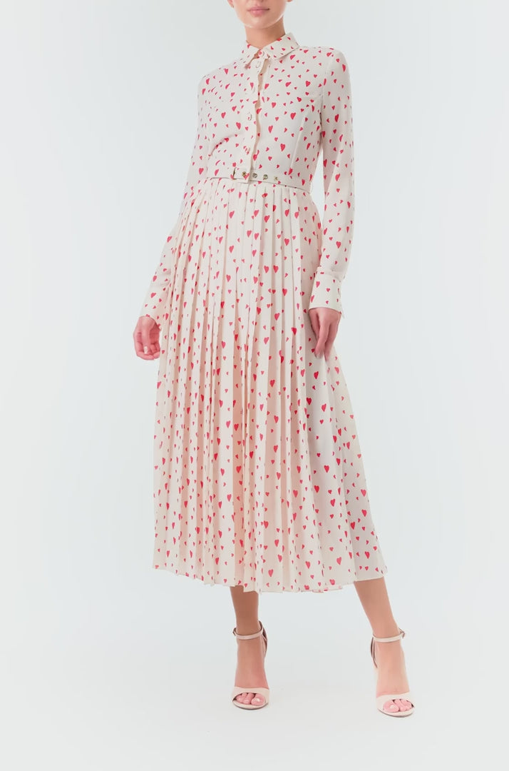 Monique Lhuillier Fall 2024 long sleeve, shirt dress with pleated skirt and belted waist in Heart Print Georgette.&nbsp; Collared neckline and button closure - video.