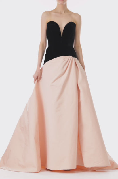 Monique Lhuillier pale blush and noir strapless ballgown with sweetheart neckline, drop waist and high slit in skirt.  