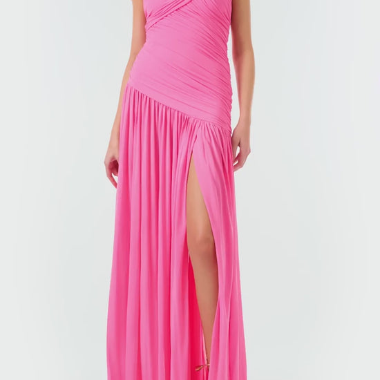 Monique Lhuillier Fall 2024 draped, asymmetric gown with drop waist, cap sleeves and front leg slit in pink crepe jersey fabric - video.