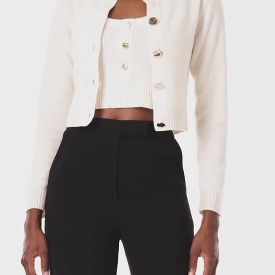 Monique Lhuillier Spring 2024 white knit cropped cardigan - video.