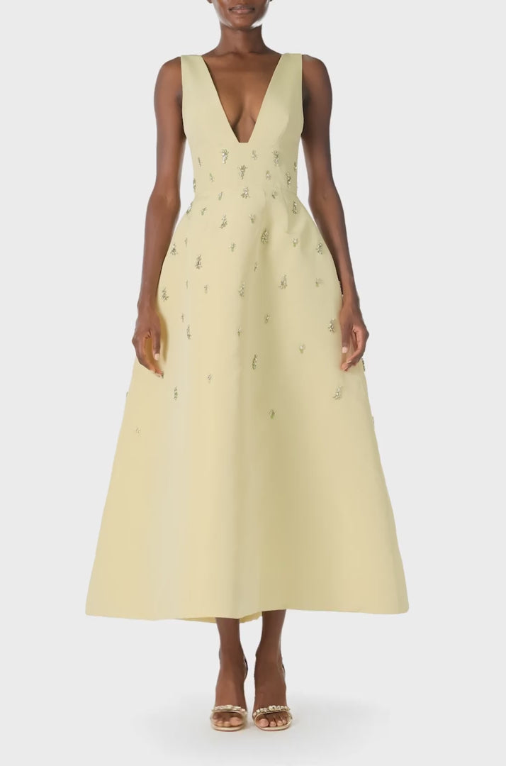 Monique Lhuillier Spring 2025 Embroidered cocktail dress with v-neckline and tea-length skirt  in Limoncello faille - video.