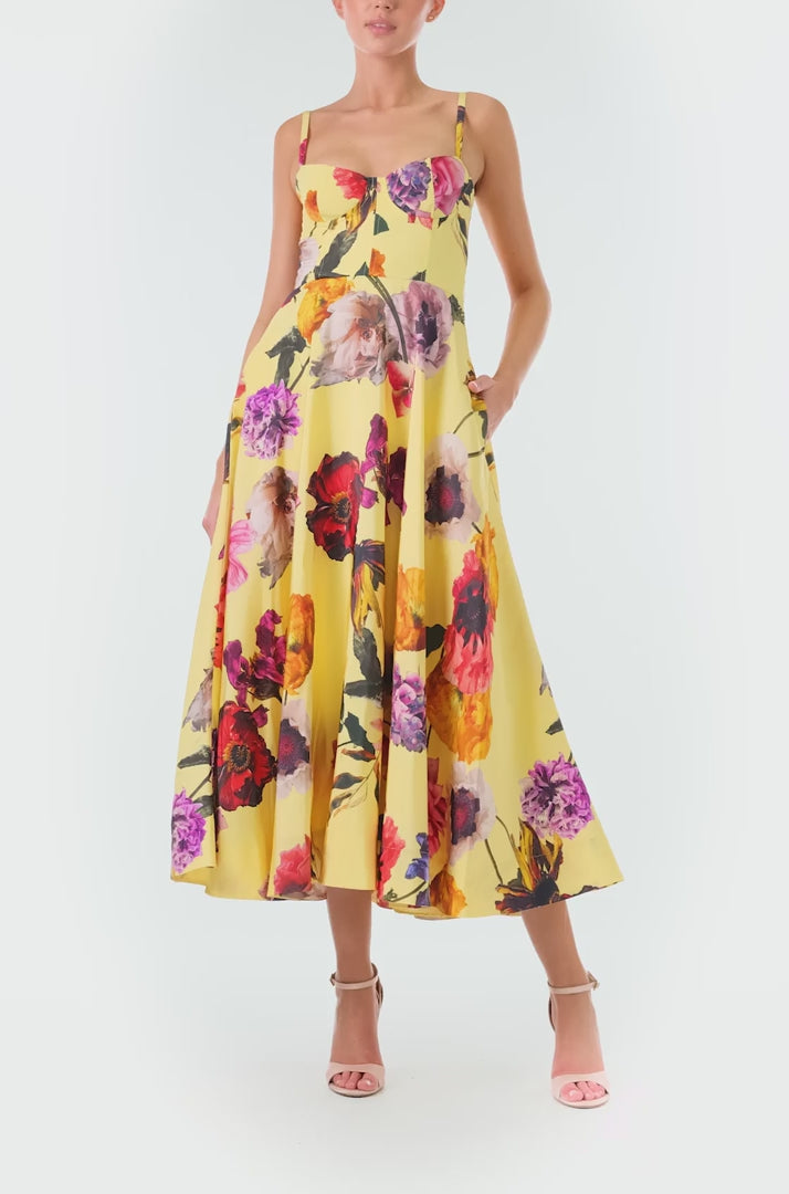 Monique Lhuillier Fall 2024 spaghetti strap, A-line cocktail dress with corseted bodice in yellow floral printed silk faille - video.