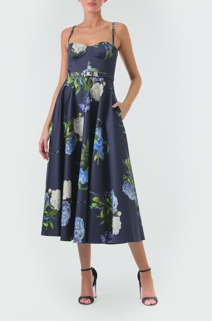 Monique Lhuillier Fall 2024 blue floral spaghetti strap, a-line midi dress with corseted bodice, pockets and belted waist - video.